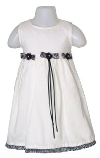 Vestido plumeti con moños y perlitas