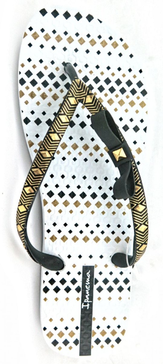 Ojota blanca con moño y detalles dorados