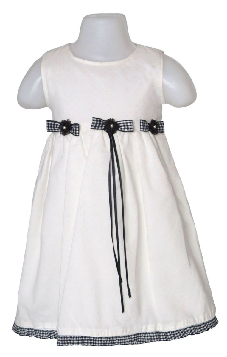 Vestido plumeti con moños y perlitas