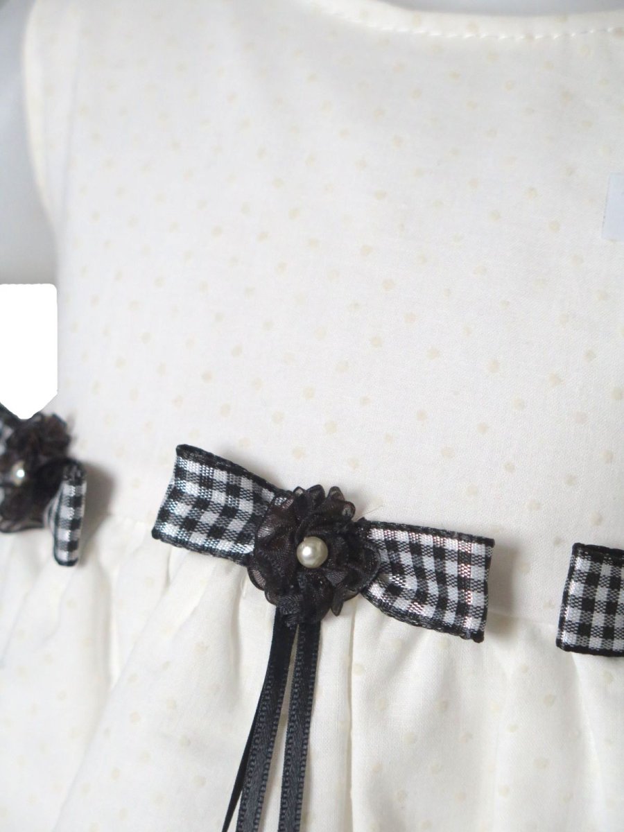 Vestido plumeti con moños y perlitas